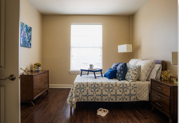 Bright Resident Bedroom with Wood Dressers at Assisted Living Facility Bright Resident Bedroom with Wood Dressers at Assisted Living Facility