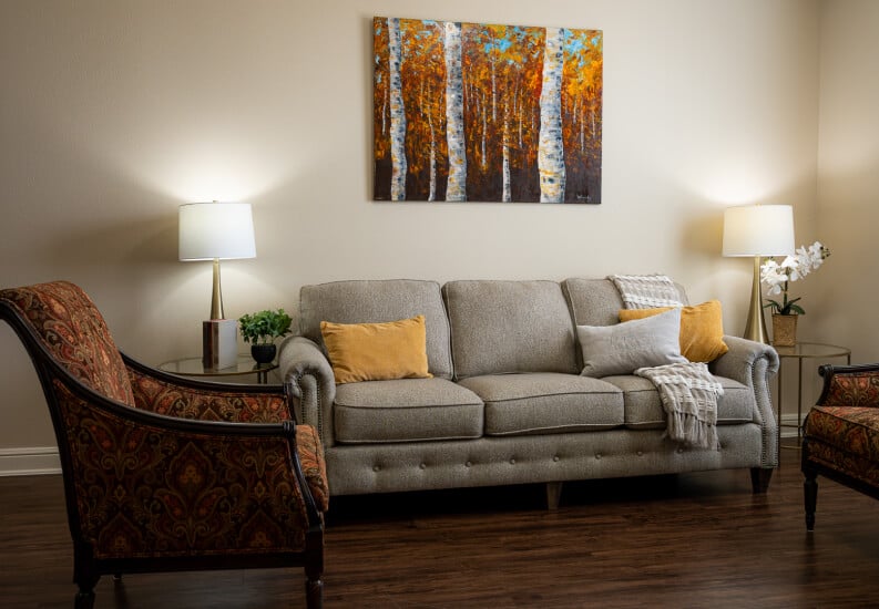 Comfortable Living Room with Sofa at Assisted Living Facility Comfortable Living Room with Sofa at Assisted Living Facility