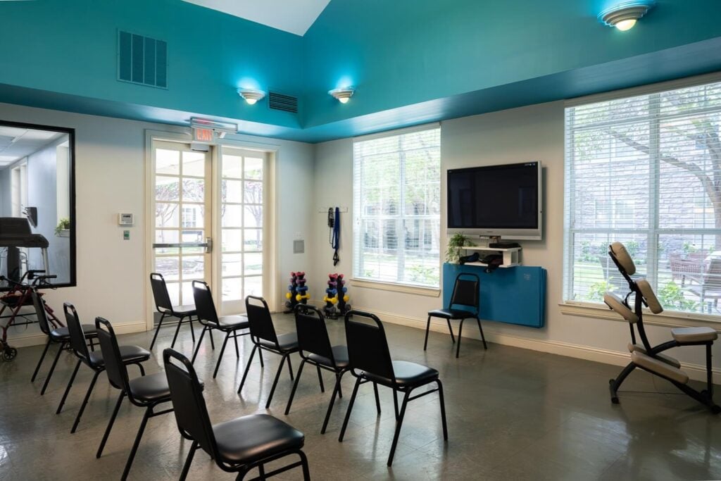 Exercise Room with Chairs and Free Weights at Memory Care Facility