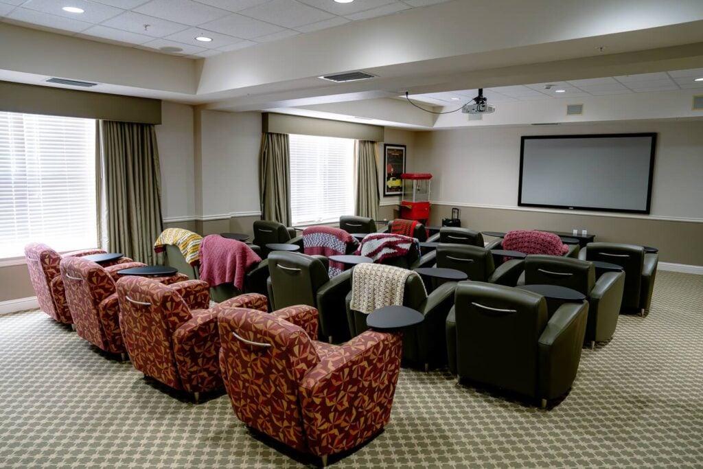 Movie Theater Room with Cushioned Recliners at Assisted Living Facility