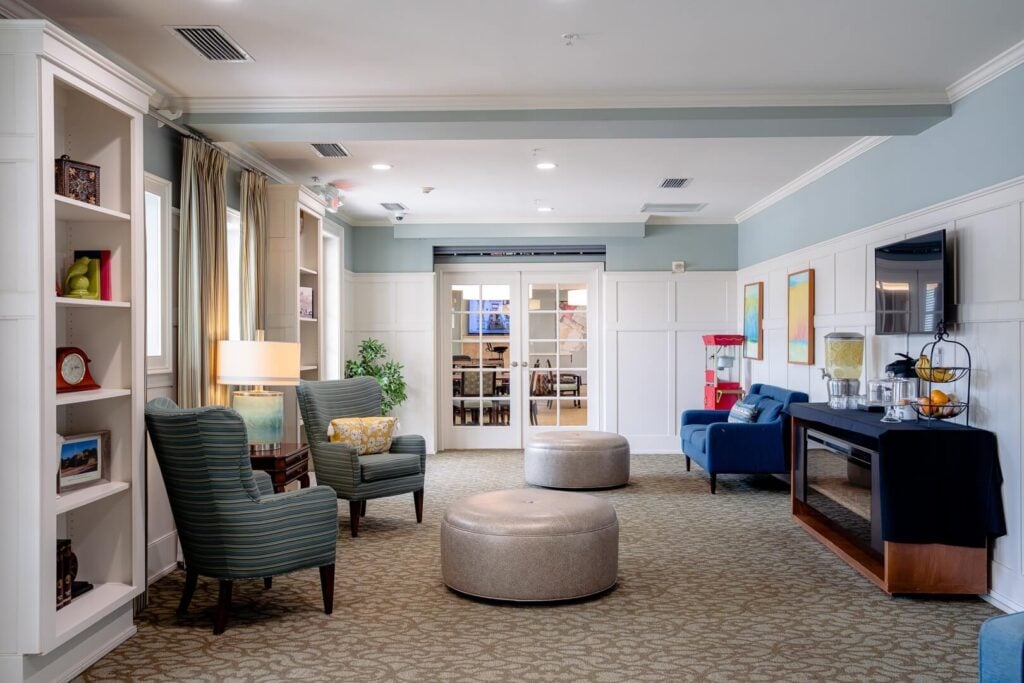 Lounge with Armchairs and Refreshment Station at Memory Care Facility