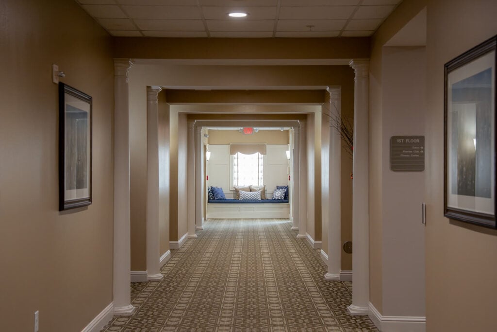 Interior Hallway with Cushioned Window Seat at Assisted Living Facility