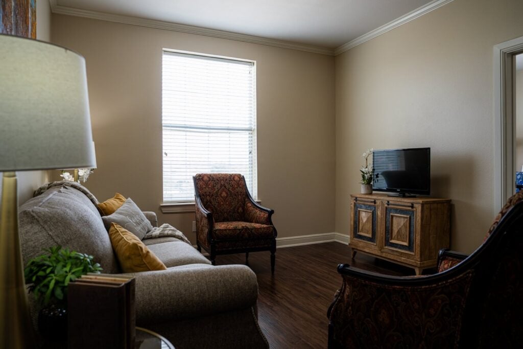 Furnished Sitting Room with Television at Memory Care Facility