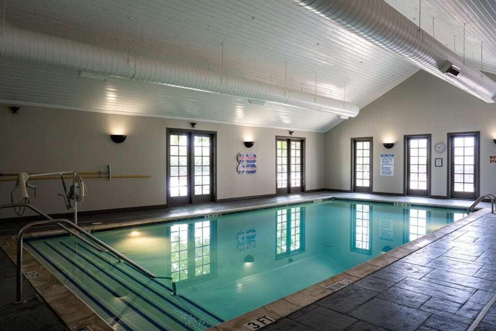 Indoor Heated Swimming Pool with Handrails at Assisted Living Facility