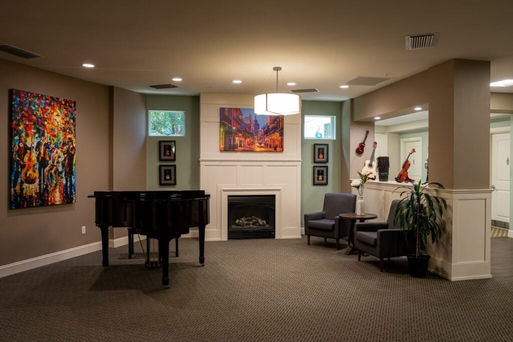 Music Lounge with Grand Piano and Fireplace at Memory Care Facility