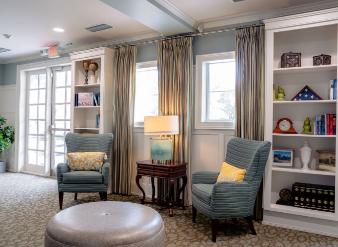 Sitting Area with Armchairs and Bookshelves at Memory Care Facility Sitting Area with Armchairs and Bookshelves at Memory Care Facility