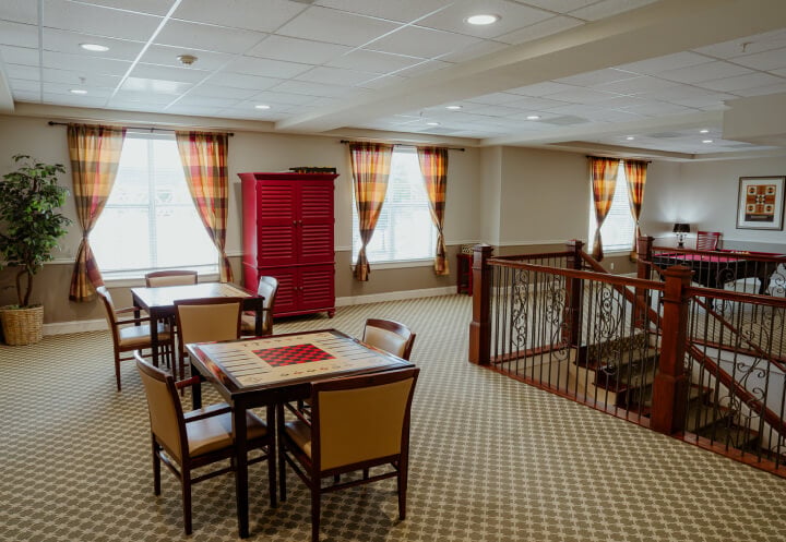 Upstairs Game Room with Checkers Tables at Memory Care Facility Upstairs Game Room with Checkers Tables at Memory Care Facility